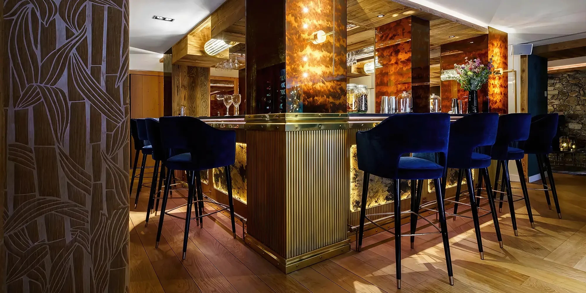 Bar Space with custom bar chairs with dark blue velvet upholstery and wood base, La Sivoliere France