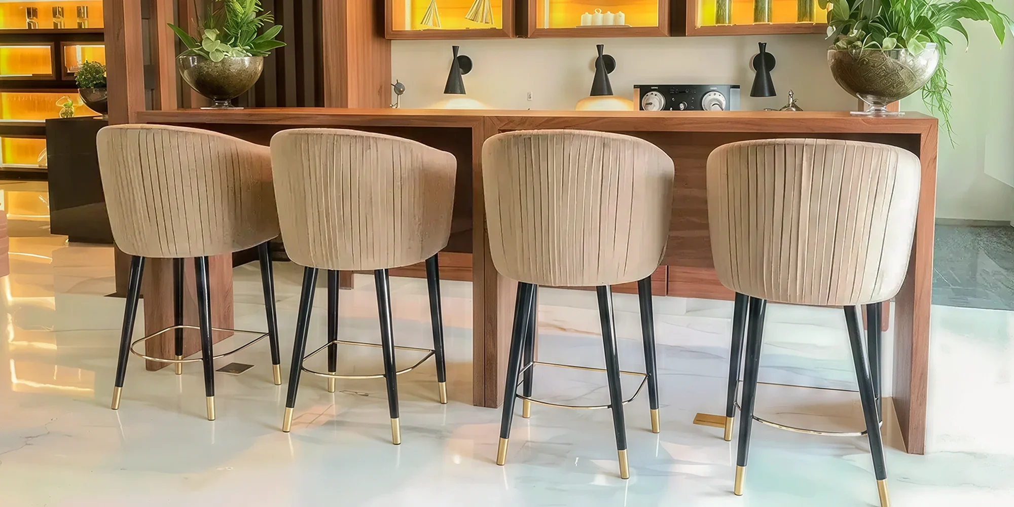 Lounge Space with custom counter chairs with wooden base and gold plated footrest and base tip, Dar Al Arkan Dubai